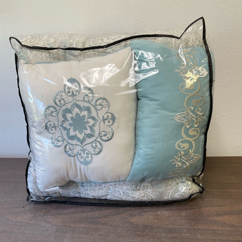 12 piece bed set brand new.  Machine wash. 100 per cent polyester.